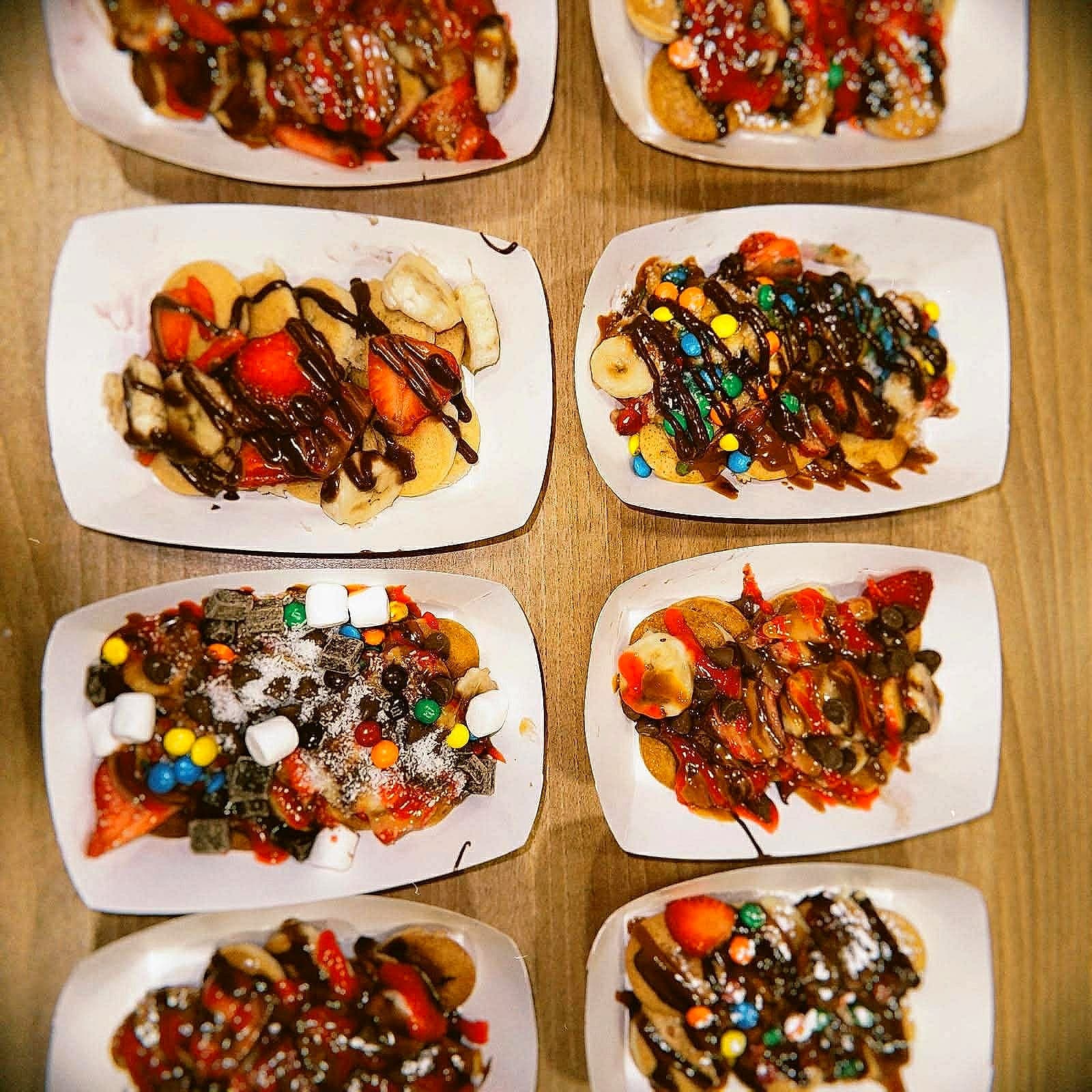 Mini pancake plates with assorted toppings at an Alhana catering event
